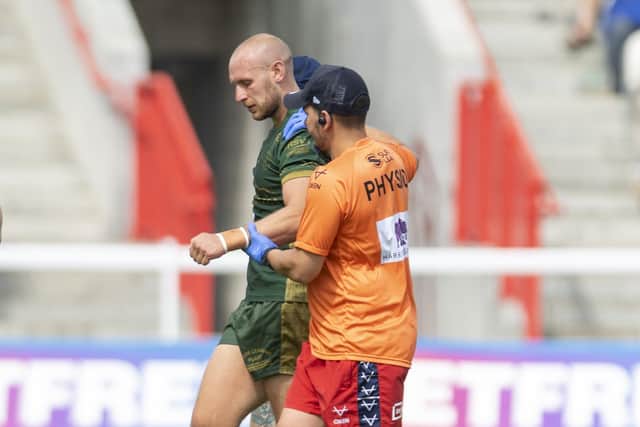 Hull KR's Dean Hadley leaves the field injured. Picture: Tony Johnson