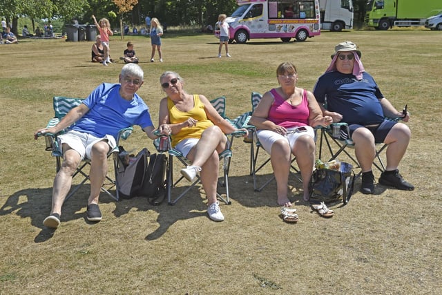 These revellers get comfortable in the sun.