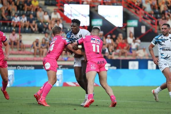Justin Sangare is tackled by Richie Myler and James Bentley during Toulouse's win over Rhinos last Saturday.