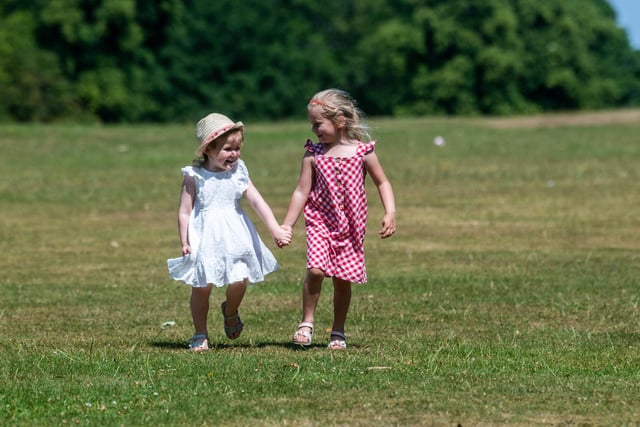 Pictured are friends Sophie Catton, aged 4, of Harrogate, and Mabel Womersley, aged 4, of Leeds, having fun in Roundhay Park.