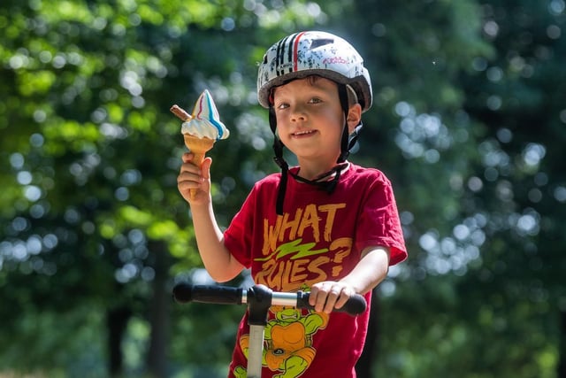 Pictured is Oliver Howson, aged 5, of Leeds, enjoying an ice-cream after playing on his scooter.