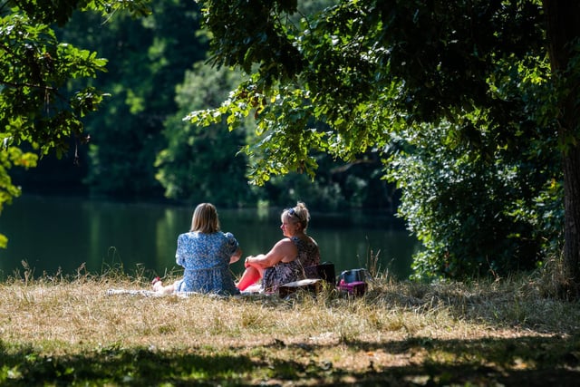 Pictured is Helen Lord, of Wakefield, with friend Suzanne Newlove, of Leeds, sitting under the trees during the midday sun whilst in Roundhay Park.