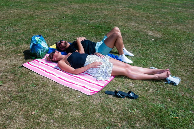 Abbie Schofield and Jordan Horsman sunbathing in Roundhay Park.