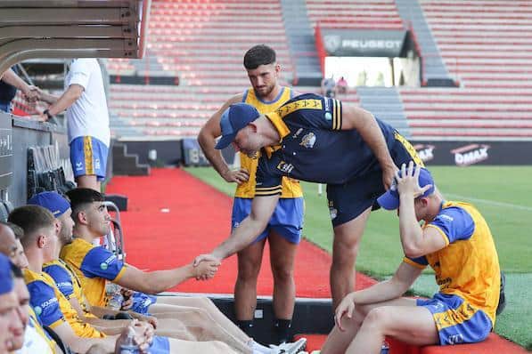 Jack Sinfield shakes hands with Rhinos coach Rohan Smith before the game in Toulouse. Picture by Manuel Blondeau/SWpix.com.