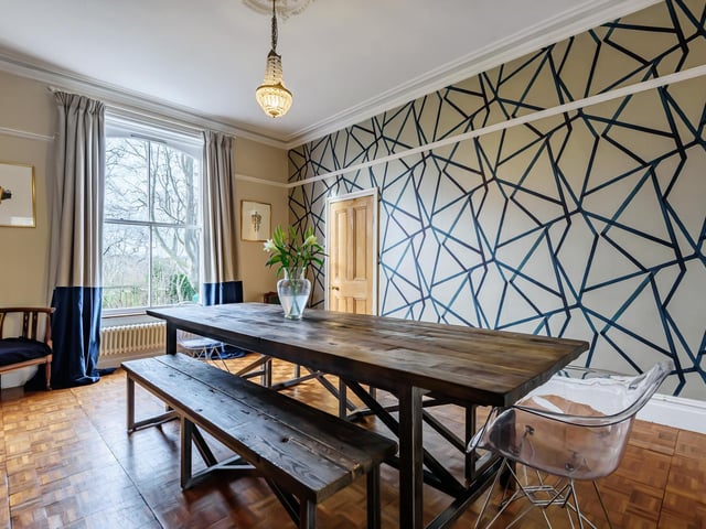 Downstairs, visitors will find a welcoming entrance hallway with parquet flooring, a boot room and toilet with underfloor heating, a bespoke kitchen designed by Neptune and an elegantly proportioned dining room which overlooks the garden.