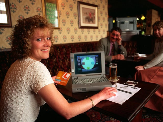 Belle Isle's Karen Hunter gets to grips with computer technology at The Wellington pub in Hunslet. She was being helped by Leeds Library and Information Services who were  running the BBC 'Computers Don't Bite' campaign.