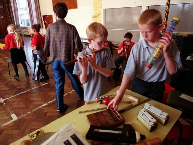 Community musician Gill Pearson takes a class at Clapgate Primary in April 1999. Pictured choosing their instruments are Dale Emmerson (left) and David Ward.