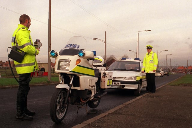 Helping launch an anti-speeding campaign in Belle Isle are motorcycle officer PC John Beevor and Inspector Michael Green in January 1999.