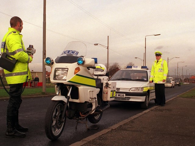Helping launch an anti-speeding campaign in Belle Isle are motorcycle officer PC John Beevor and Inspector Michael Green in January 1999.