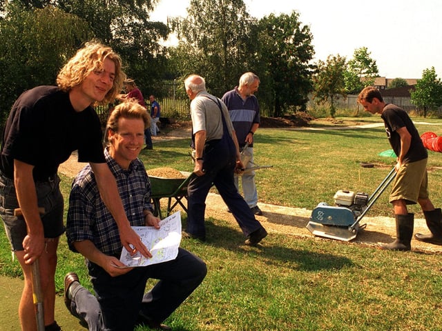 Groundwork Trust and the British Trust for Conservation Volunteers work on pathways and an adventure play area in the grounds of Broom Court children's hostel in August 1998. Pictured are Terry Claxton (left) of BTCV and Paul Bunton of Groundwork Trust checking the plan as the volunteers lay the pathway.