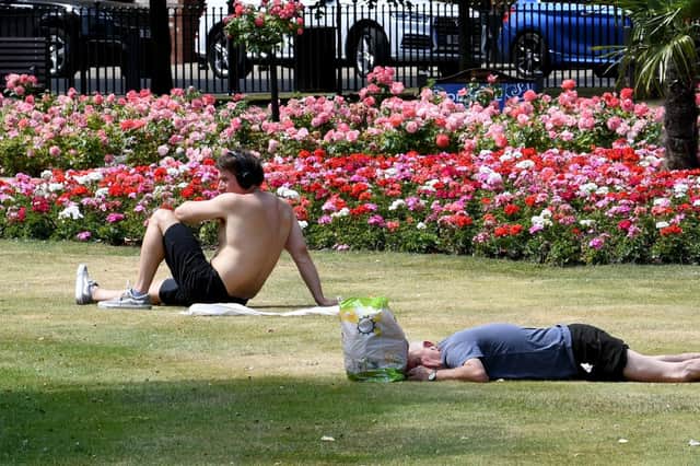 People enjoy the sunshine in Park Square as the country swelters in a heatwave.