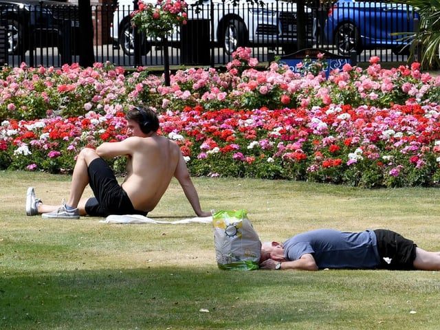 People enjoy the sunshine in Park Square as the country swelters in a heatwave.