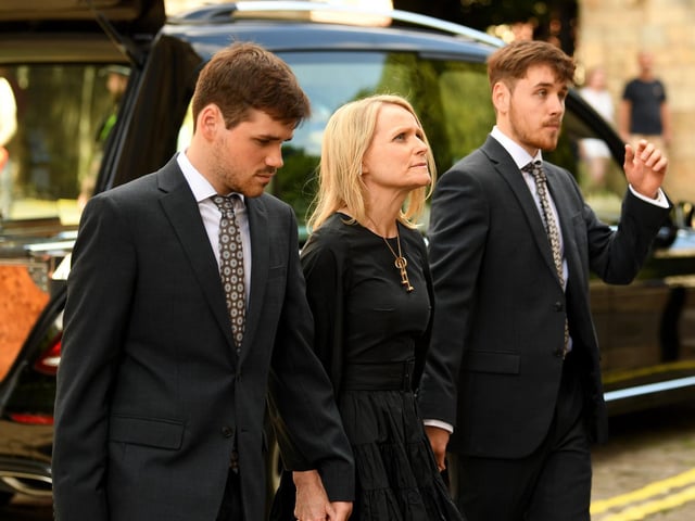 The funeral of much-loved presenter Harry Gration took place at York Minster today, Pictured is his wife Helen and their two children Harrison and Harvey.