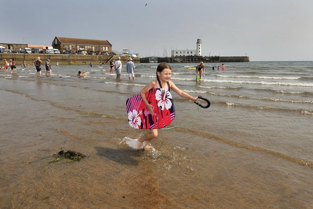 Mya Norton cools off in the sea in Scarborough's South Bay. The warm weather will stick around until Sunday August 14 and it could reach 30C in many parts of the region over the weekend
