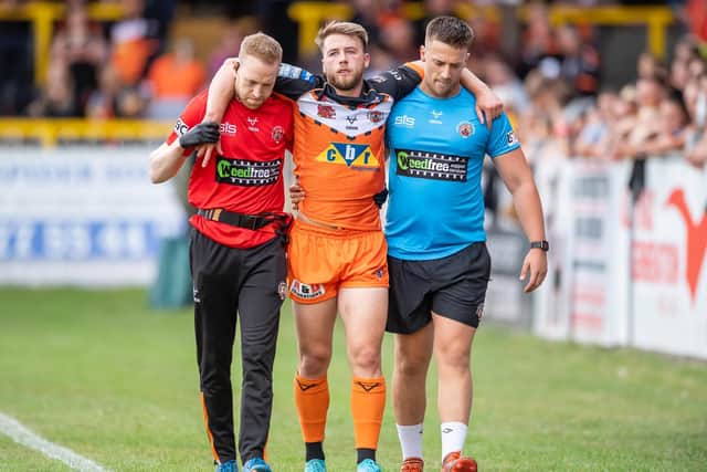 Danny Richardson is helped from the field after suffering a knee injury. (Picture: SWPix.com)