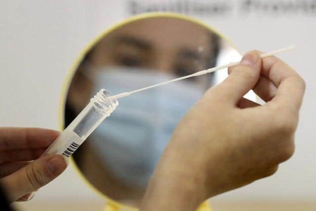 File photo dated 25/09/20 of a person undertaking a coronavirus test. Photo: PA