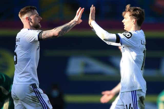 HIGH FIVE: Leeds United captain Liam Cooper, left, and Diego Llorente are expected to start at the heart of the Whites' defence against Manchester City. Picture: Lindsey Parnaby/PA Wire.