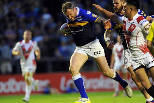 Jamie Peacock storms away to store for Rhinos in their 2015 Cup semi-final defeat of Saints. Picture by Steve Riding.