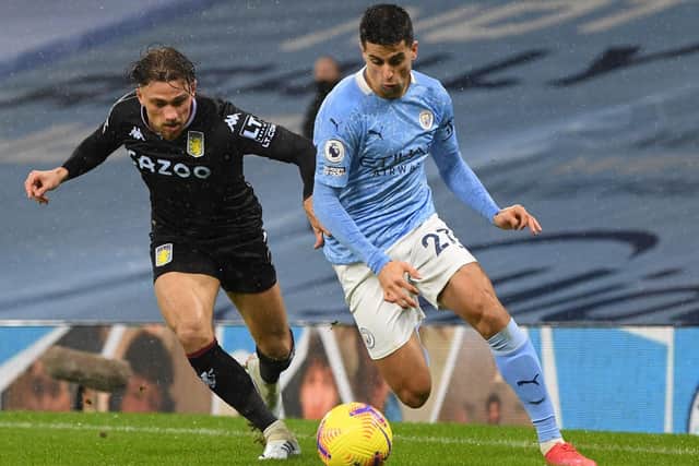 LICENCE: For Manchester City's Joao Cancelo, right, to drift inside as part of a case of 'inverting' the full back. Photo by Shaun Botterill/Getty Images.