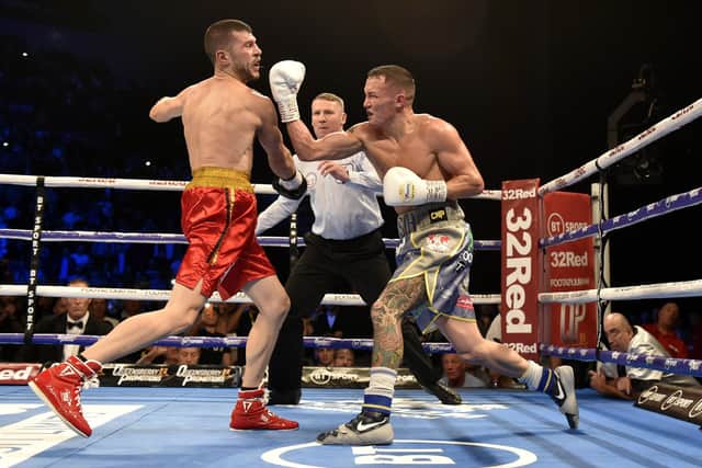 TOP OF THE WORLD: Josh Warrington gets in a last big punch on Sofiane Takoucht before the referee moves in to stop the fight at Leeds Arena in October 2019. Picture: Steve Riding.