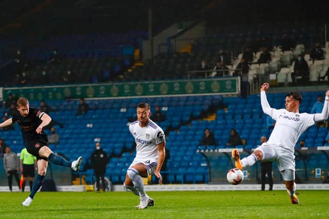 NO HYPERBOLE: About Manchester City's Kevin De Bruyne, left, pictured as Leeds United duo Liam Cooper, centre, and Robin Koch, right, look to block his shot at Elland Road. Photo by JASON CAIRNDUFF/POOL/AFP via Getty Images.