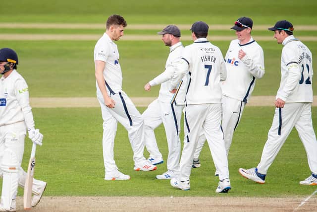 STRIKE BACK: Yorkshire's Ben Coad celebrates the wicket of Glamorgan's Kiran Carlson. Picture by Allan McKenzie/SWpix.com