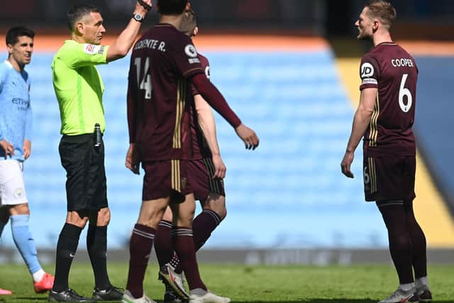 LAST LAUGH: For Leeds United through Saturday's 2-1 triumph at Manchester City despite Whites captain Liam Cooper, right, being shown a straight red card. Photo by Michael Regan/Getty Images.