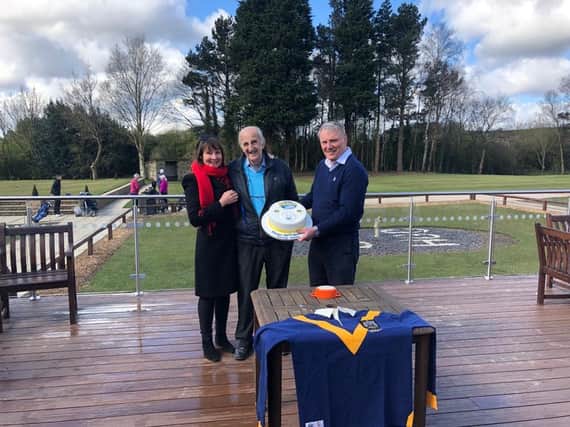 Rhinos chief executive Gary Hetherington presents a cake to 90th biorthday boy Lewis Jones and his daughter Karen James. The trio are pictured with a replica of Leeds' 1957 Wembley jersey. Picture by Leeds Rhinos.
