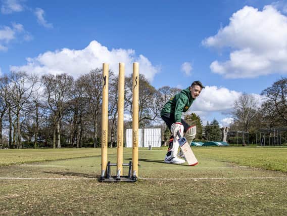 Adel Cricket Club junior Billy Hodges runs between the stumps taking on the challenge of getting 12,472 runs in three days