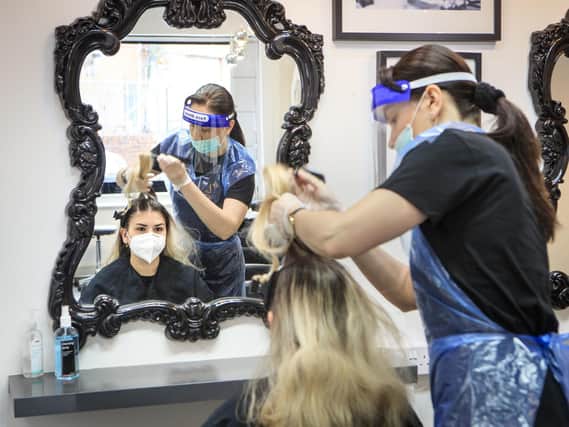 File photo of a client having their hair worked on at The Salon in Leeds. Picture: Danny Lawson/PA Wire