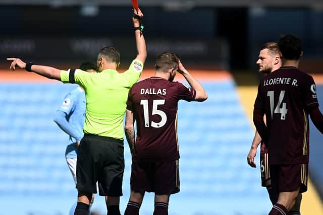 RED CARDED: Leeds United's Liam Cooper, far right, is sent off by referee Andre Marriner. Picture: Michael Regan/PA Wire.