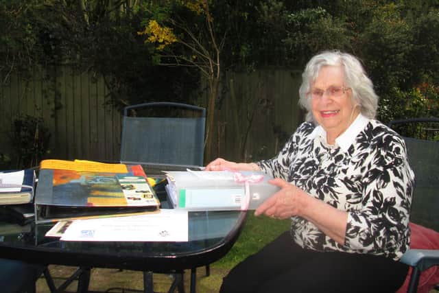 Ann Hart, secretary of the Leeds PHAB club, pictured with her personal archives and memories of Prince Philip's visits to the charity over the years.