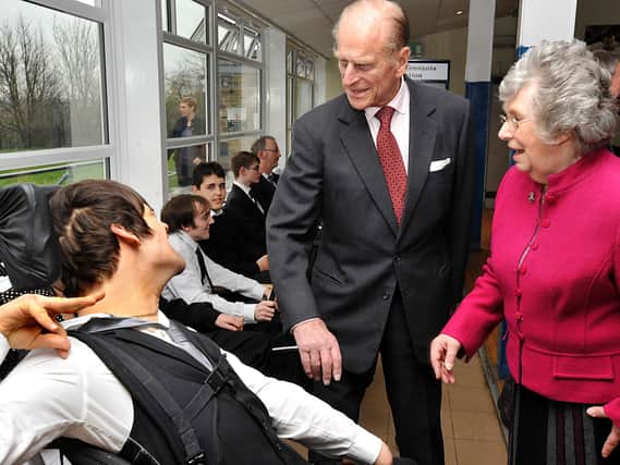 Prince Philip pictured in 2011 during a visit to the Prince Philip PHAB Club, meeting up with Nathan Pride, 19, accompanied by Ann Hart, then President of PHAB Club. Picture: Graham Lindley