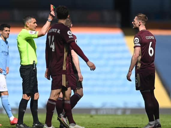 Leeds United captain Liam Cooper is sent off after a VAR review at Manchester City. Pic: Getty