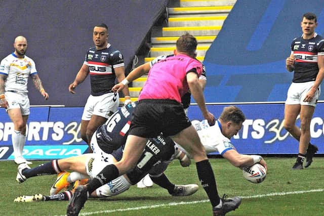 Brad Dwyer scores in Rhinos' Super League round one win over Wakefield. Picture by Bruce Rollinson.