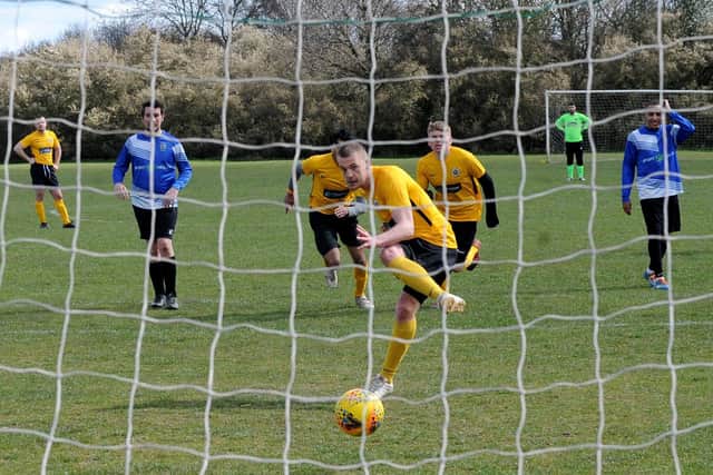 Nathan Powell, of North Leodis, scores from the penalty spot in the 6-0 win over Headingley Rovers Res. Picture: Steve Riding.