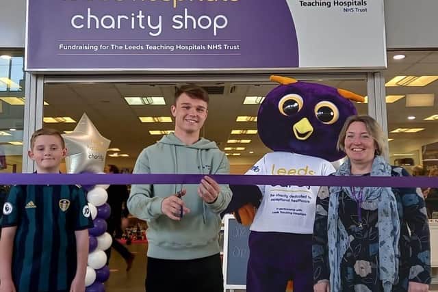 Left to right: Rhys Pearson, Jamie Shackleton, Ernie, Leeds Hospitals Charity mascot and Thadra Bryant, retail manager, Crossgates Charity shop.