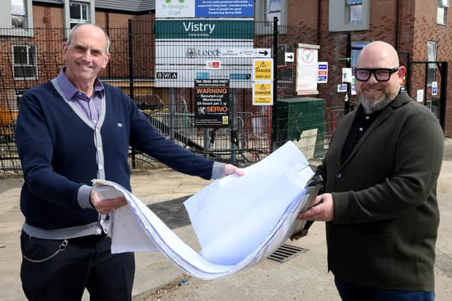 Chris Fields (left),  chief executive at St Georges Crypt, looking at the plans for the flats at Hedley Chase in New Wortley with Nathan Wilkinson for Brewster Bye Architects .
Photo: Gary Longbottom