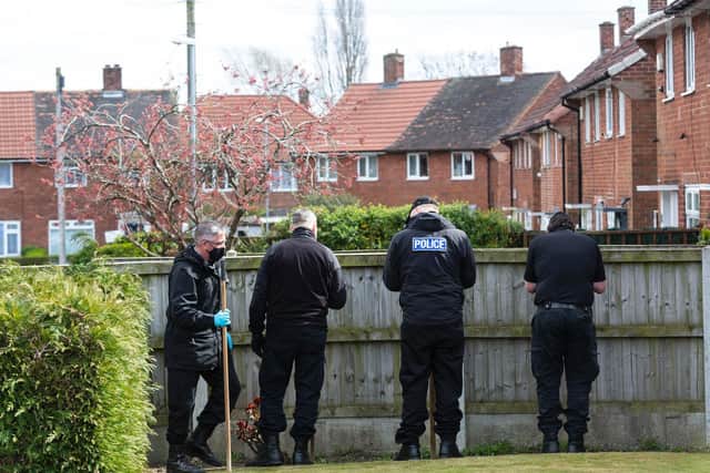 Police on the scene after a teenager's hand was cut off in a machete attack in Swarclife. Photo: SWNS