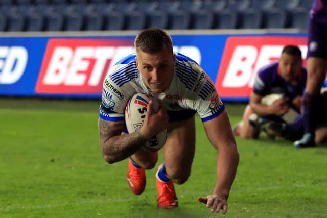 Smiles: Leeds Rhinos' Alex Mellor scores his side's only try in the home defeat by Wigan. Picture: Mike Egerton/PA Wire.