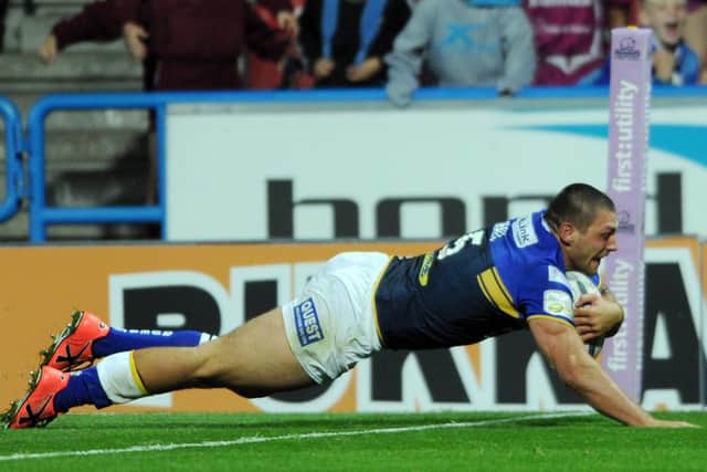 Ryan Hall dives in to score the try which secured the league leaders' shield for Leeds in 2015. Picture by Steve Riding.