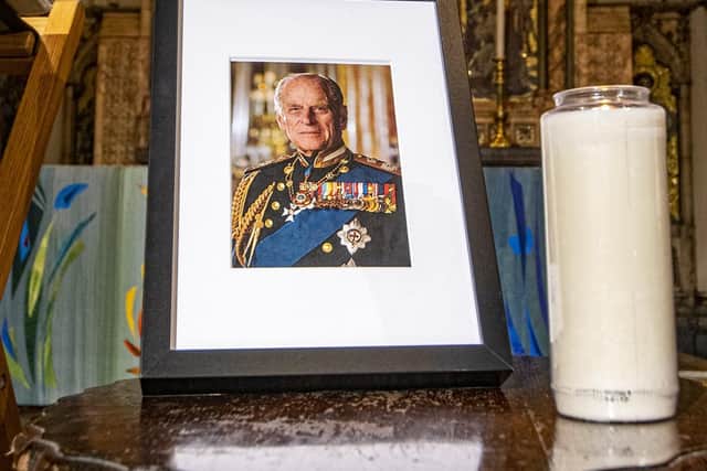 A photo and candle tribute in Leeds Minster following the death of the Duke of Edinburgh.
