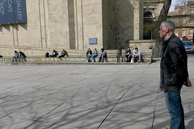 A man observes the minute's silence near the cenotaph in Leeds City Centre.