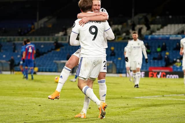 BACKING: For Leeds United no 9 Patrick Bamford from team mate Luke Ayling, pictured as the duo celebrate Bamford's strike in February's 2-0 victory against Crystal Palace. Photo by Jon Super - Pool/Getty Images.