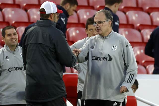 RESPECT: Leeds United head coach Marcelo Bielsa, right, and Liverpool boss Jurgen Klopp fist bump after September's match at Anfield. Picture: Phil Noble/PA Wire.