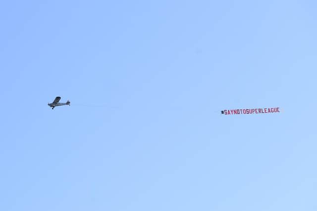 Leeds United fans fly a banner over Elland Road opposing the European Super League. Pic: Simon Hulme