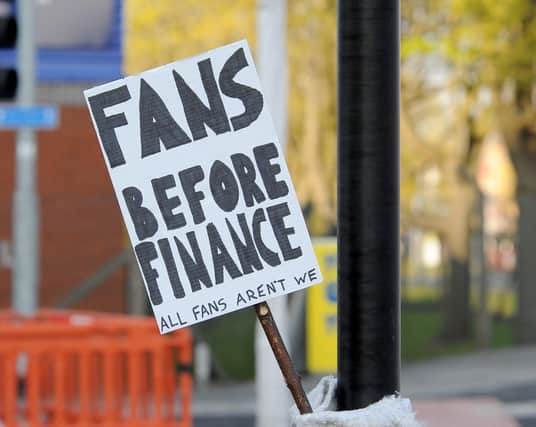 Fans gathered to protest against the European Super League outside Elland Road last night. Picture by Simon Hulme