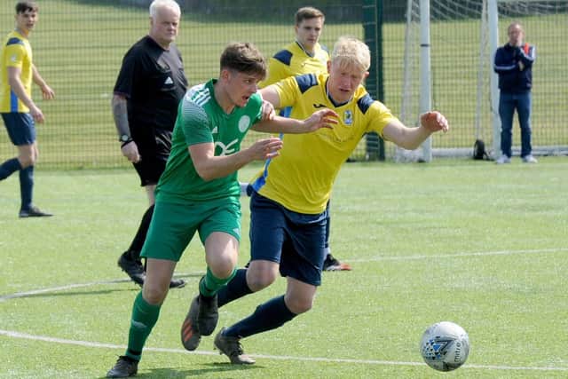 Danny Powell, of Mount St Marys, takes on Danny Philips, of Gildersome Spurs. Picture: Steve Riding.