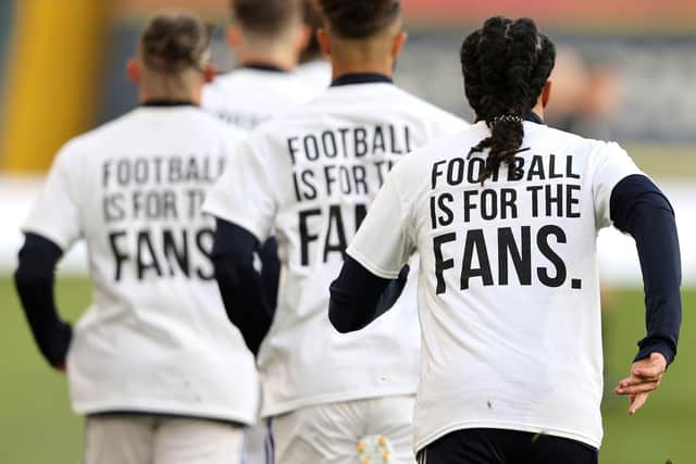 Leeds United players protested during the match against Liverpool at Elland Road on Monday night. Picture: PA.