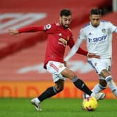 Manchester United midfielder Bruno Fernandes and Leeds United winger Raphinha challenge for the ball. Pic: Getty